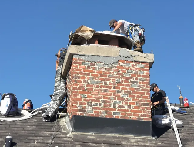 Kissimmee Chimney Sweep installing a custom chimney crown in Kissimmee, FL