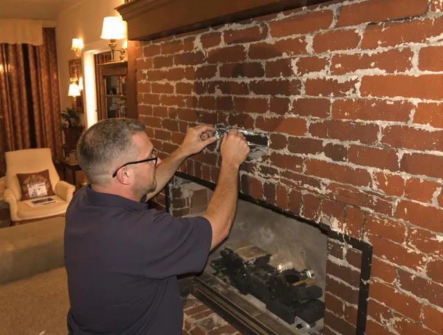 Kissimmee Chimney Sweep expert fixing a fireplace in Kissimmee, FL